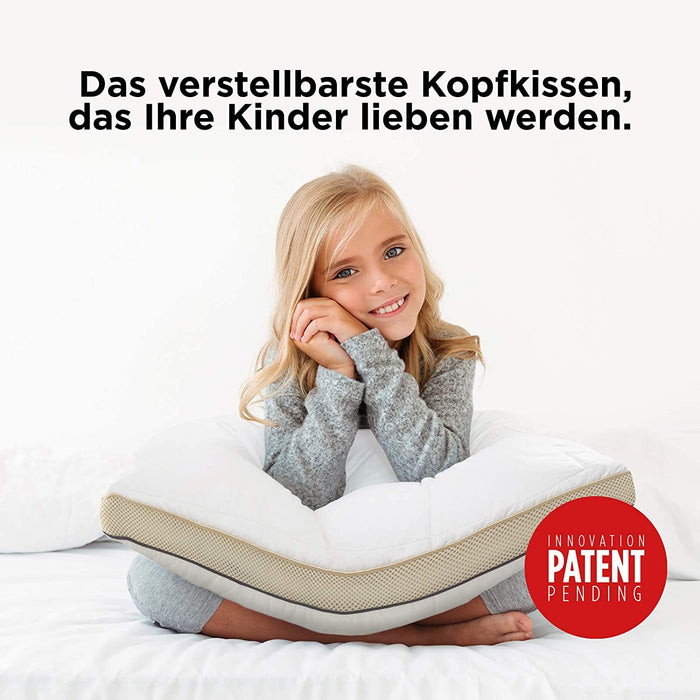 Mädchen schläft auf ökologischem 'My first pillow', das Nackenstütze und natürliche Materialien kombiniert